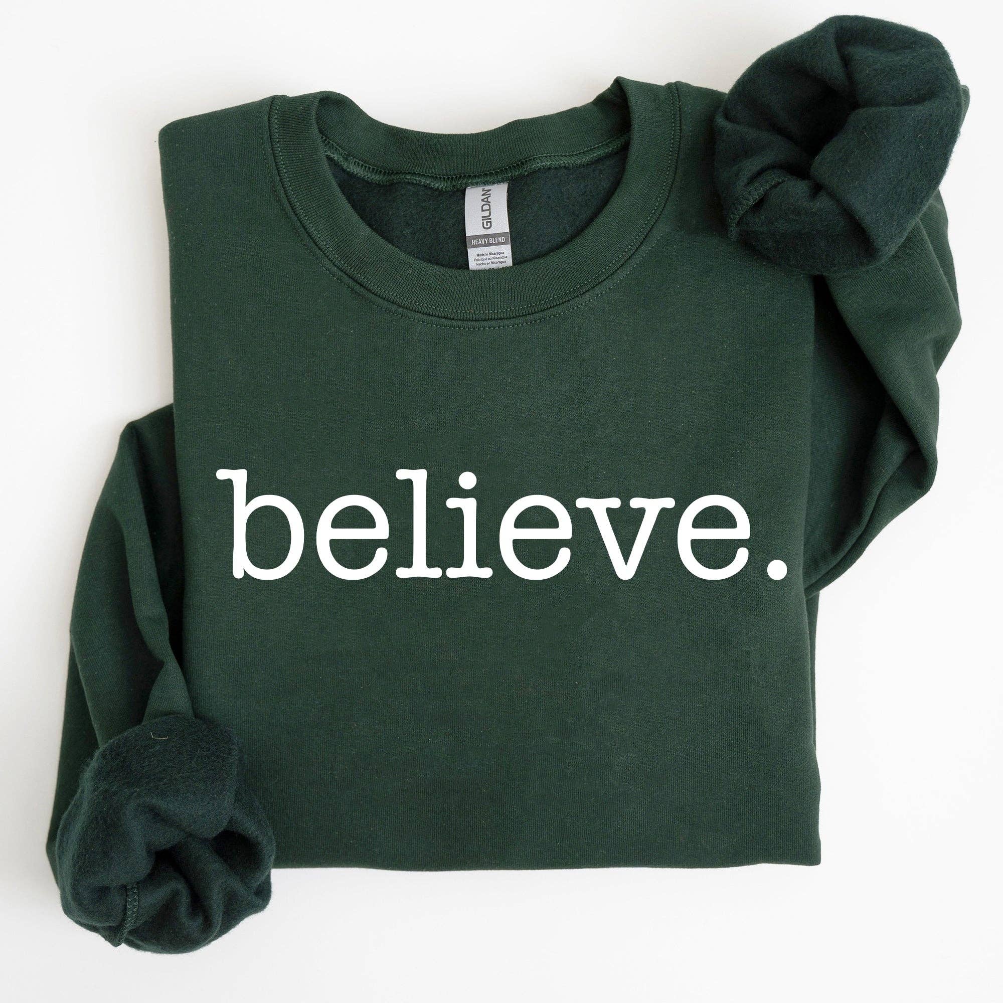 Refinery Number One LLC – Camisola gráfica - Mulher por atacado – Believe, Clássico Minimalista, Camisola de Natal com Neve Santa1
