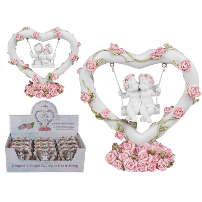 Polyresin angel couple in heart swing with pink, for wholesale by Out of the blue KG