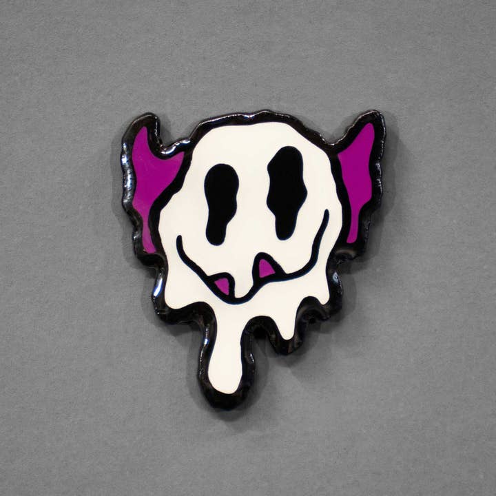 Melty Monster Smiley Face | Glow-in-the-dark Enamel Pin for wholesale by Hi, Hello There
