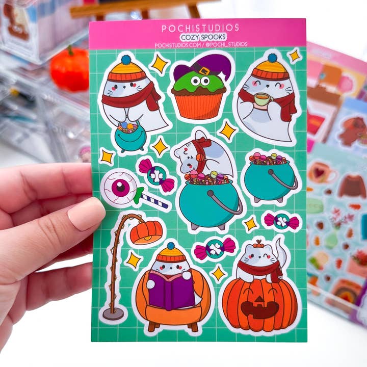 Cozy Spooks Ghostie Chubbs Cat Vinyl Matte Sticker Sheet for wholesale by Pochistudios