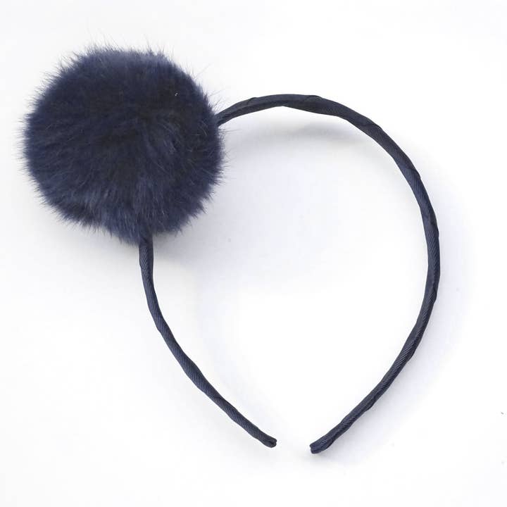 Cerchietto con pompon pavone grande per la vendita all'ingrosso da parte di Verity Jones London