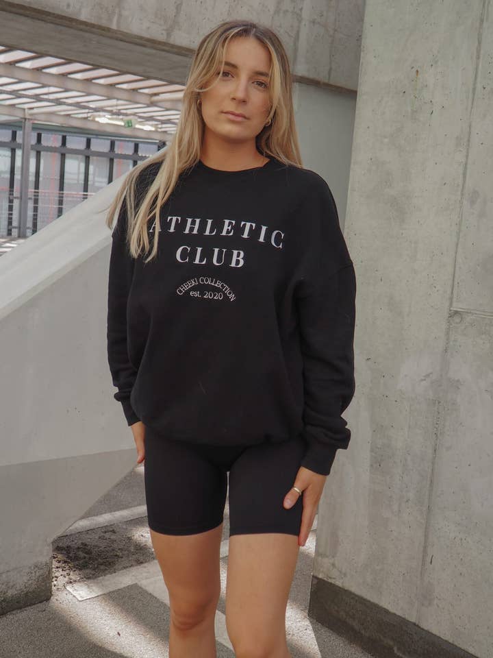 Chandail à capuchon Athletic Club | Noir pour la vente par Cheeki Collection