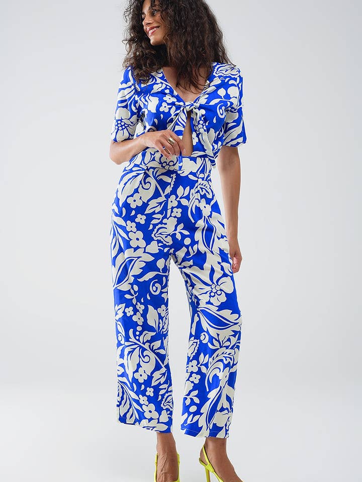 Blå Blå jumpsuit med kort ärm, knytbar nyckelhåls-urringning och blommönster för wholesale på Faire3