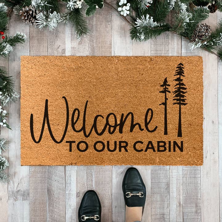 Welcome to our Cabin Doormat with Pine Trees for wholesale by Nickel Designs Doormats