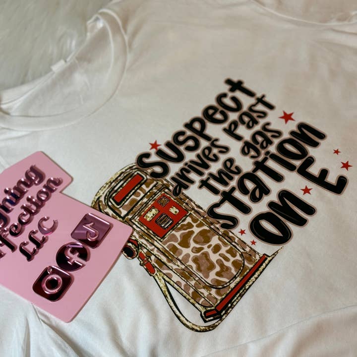 Le suspect passe devant la station-service sur E. pour la vente par Designing Perfection LLC