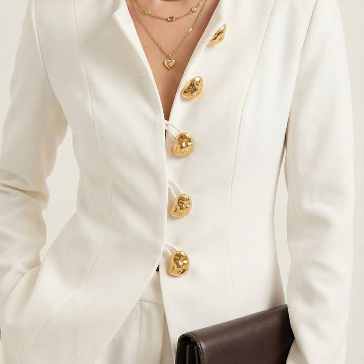 Ensemble deux pièces sur mesure avec veste à boutons et pantalon large pour la vente par Modenaire