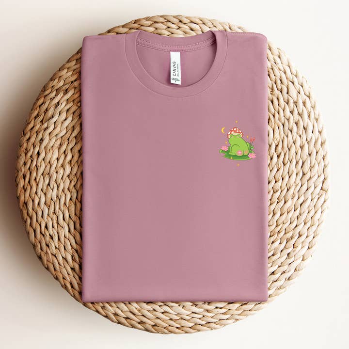 Las Changuis Tianguis - Vendita all'ingrosso Maglietta serigrafata - Donna - Maglietta Healing Frog Comfort - Sana, Sana, Colita de Rana1