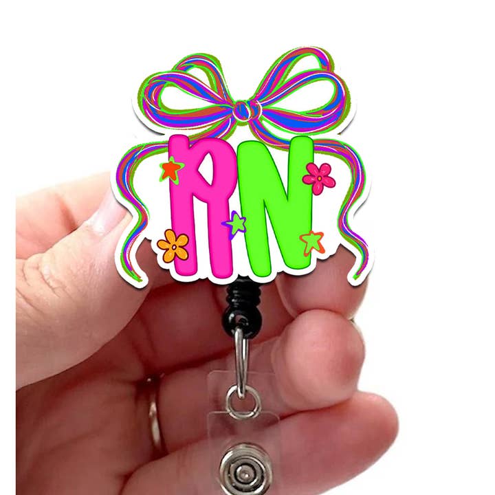 RN Neon Bow Acrylic Badge Reel with Retractable Cord for wholesale by Good Girl Gone Badge