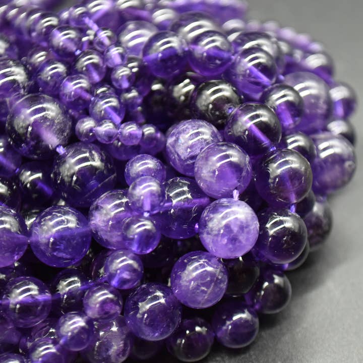 Grade A Natural Amethyst Round Semi-Precious Beads for wholesale by Oriental Direct Craft Supplies