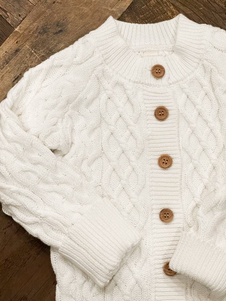 Cream Cable Knit Button Up Romper for wholesale on Faire2