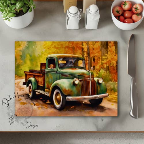 Planche à découper en verre "Vieux camion de ferme sur une route d'automne" pour la vente par Dark Horse Dream Designs LLC