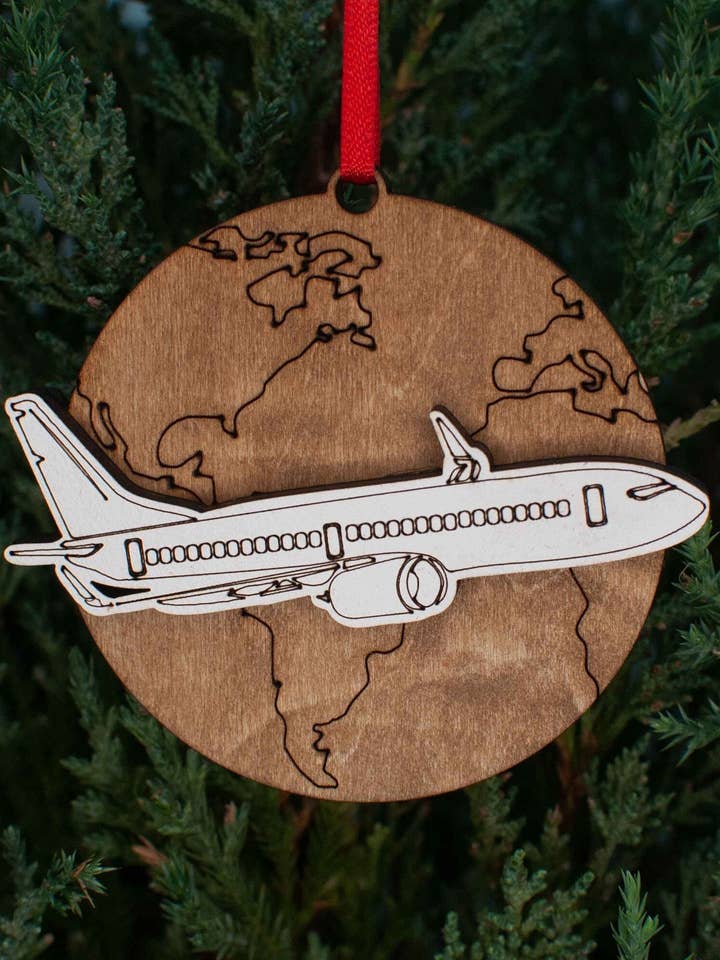 Jet Airplane over World Christmas Ornament, Travel and vacation ornaments for wholesale by The Little Ornament Shop