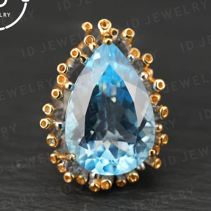 Handgemaakte blauwe topaasring| unieke druppelvormige edelsteen| vintage zilveren ring met gouden accenten| boho sieraden| statement edelsteenring voor wholesale door idjewelry