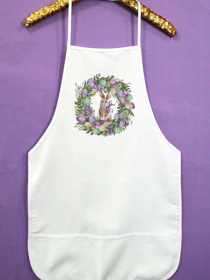 Purple Floral Wreath Center Bunny Easter Apron 17222a for wholesale by Cali Boutique Wholesale