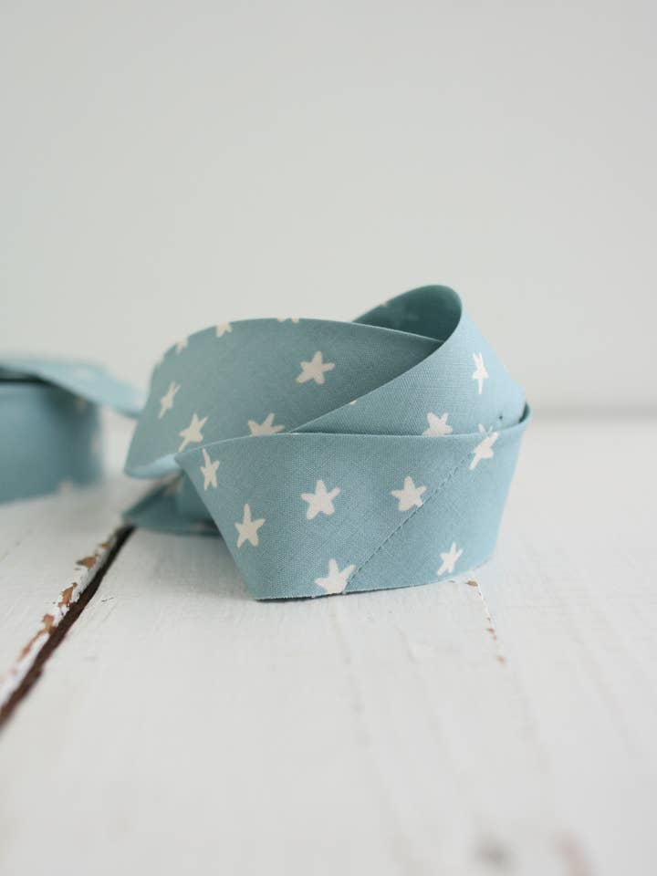 2.5" Bias Quilt Binding – Starry Soft Blue Ruby Star for wholesale by Bessie Pearl Binding Co