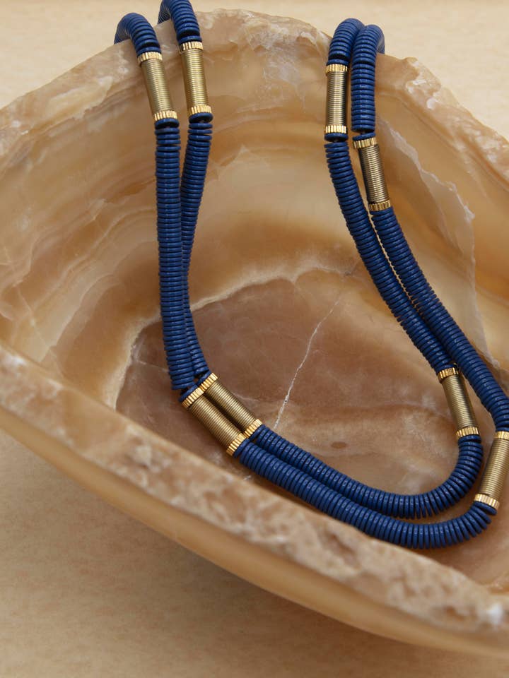 949Bl-Gld Long Blue Necklace With Gold Hematite Discs And Be for wholesale by Sea Lily
