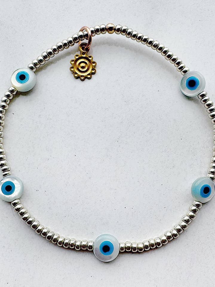 Evil Eye Stretch Beaded Bracelet - silver for wholesale by On the Lookout Jewelry