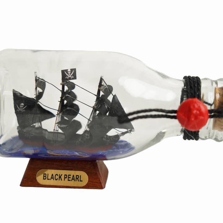 Black Pearl Pirate Ship in a Glass Bottle 5" for wholesale by Hampton Nautical