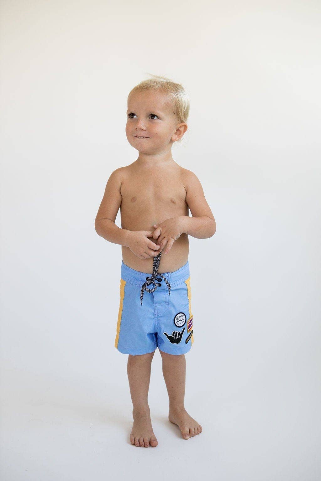 Kid’s Boardshorts in Light Blue and Yellow Colorblock Patch for wholesale on Faire5