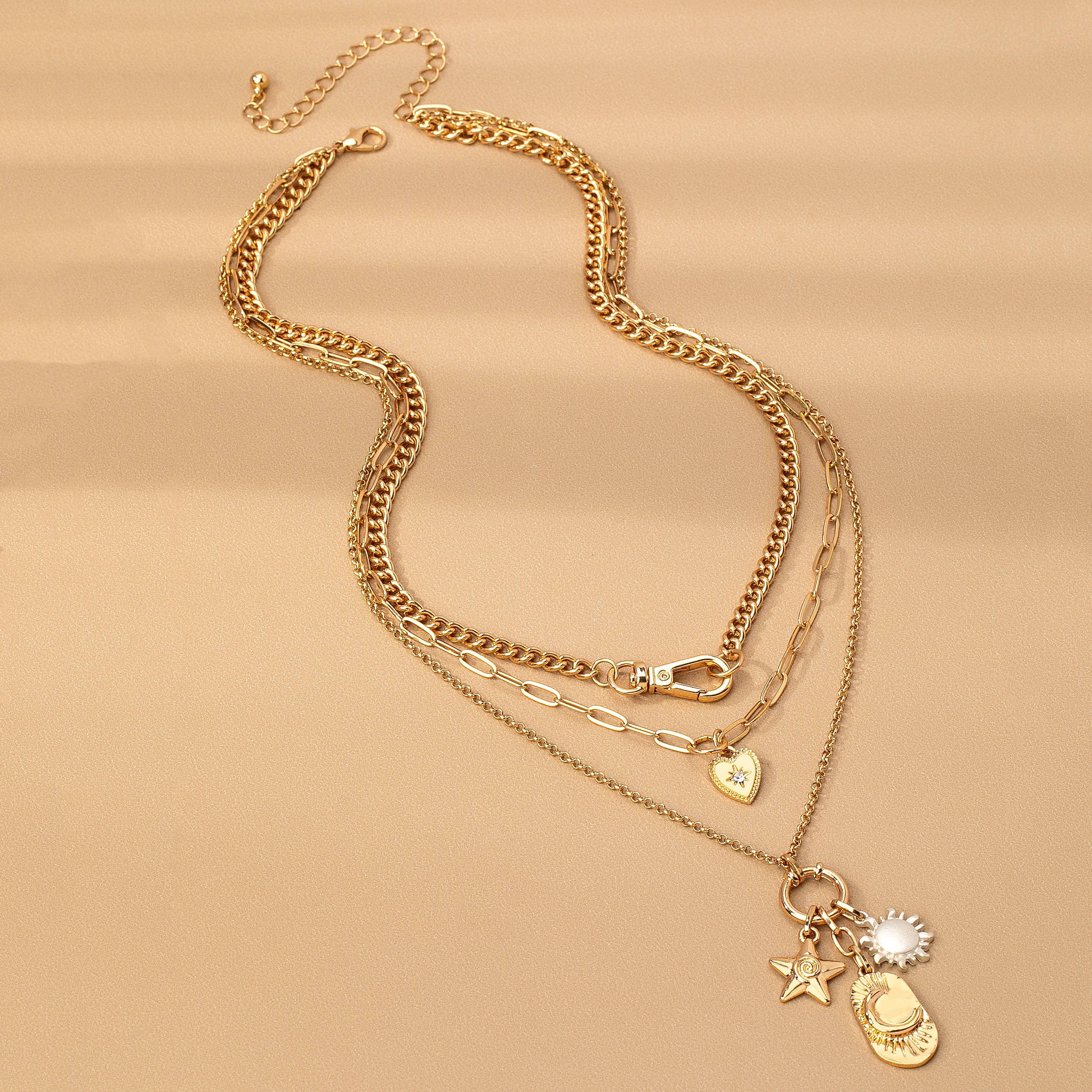 GOLD MULTI LAYER CELESTIAL STAR MOON CHARM NECKLACE | 80N92439 for wholesale on Faire1