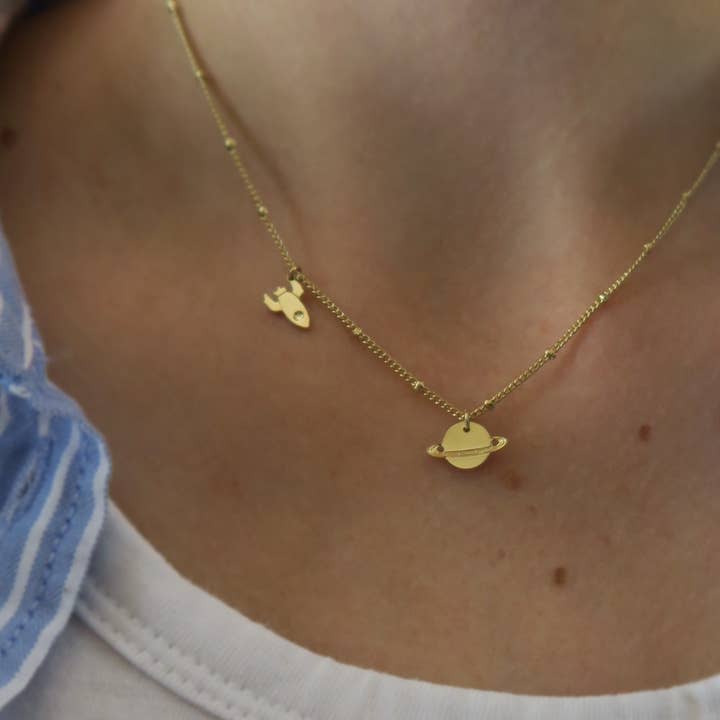 Yellow gold Mini planet Saturn and mini rocket necklace for wholesale on Faire1