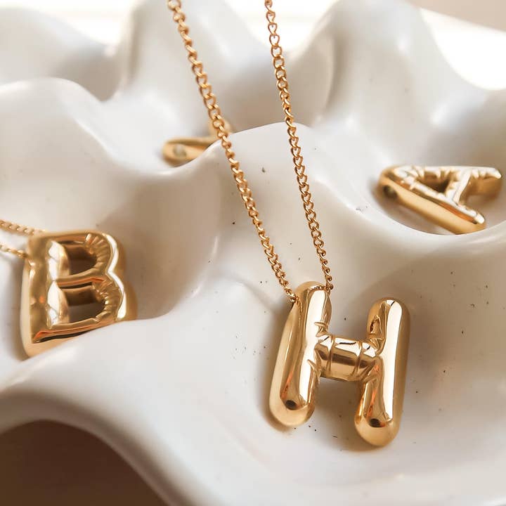 Hayes 18K Gold Non-Tarnish Balloon Alphabet Necklace and other Purchase Wholesale savy bling. Free Returns & Net 60 Terms on Faire trending on Faire.