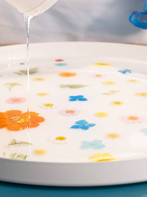 Floral resin table (white version) for wholesale by Paige Alexander