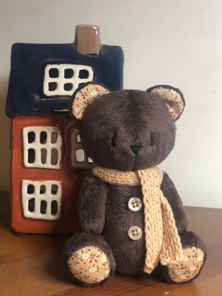 Dark brown teddy bear with a scarf for wholesale by Frank and Bubby