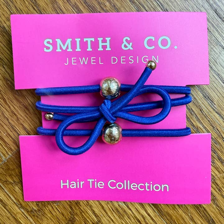 Hårsnoddset med rosetter - Safirblå för wholesale av Smith and Co. Design