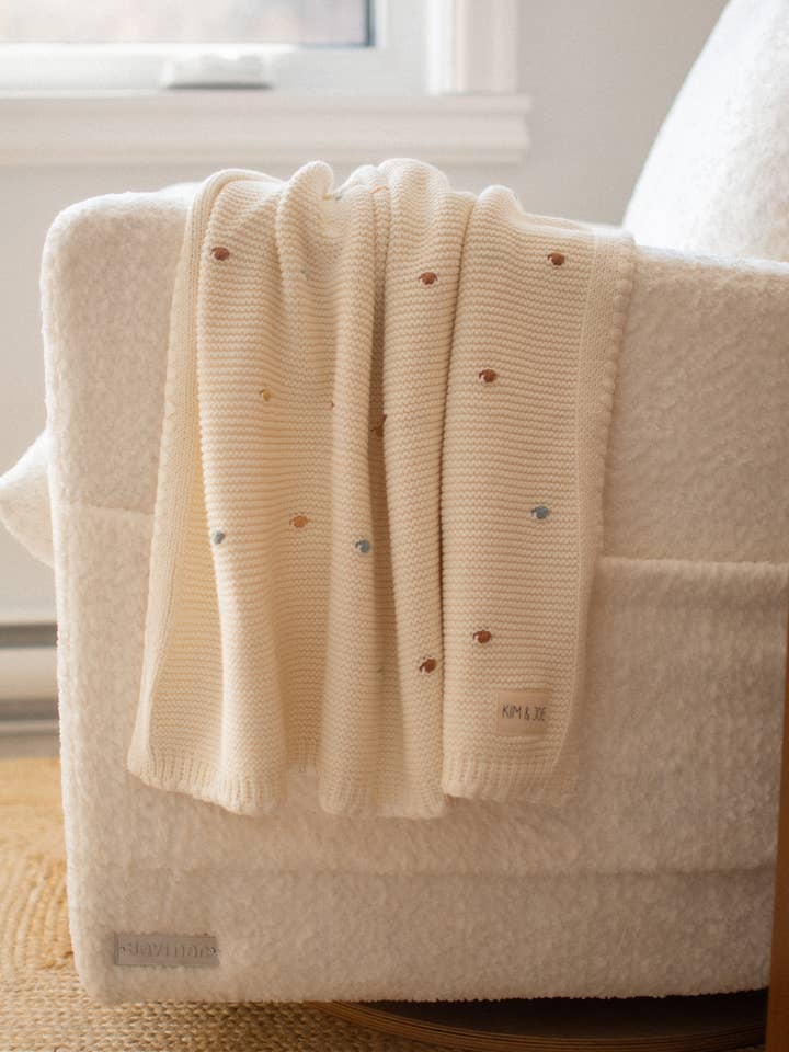 Crocheted lovey with multicolored polka dots for wholesale by Kim & Joe