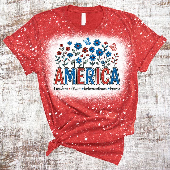 Maglietta scolorita America Floral 4 luglio per la vendita all'ingrosso da parte di Sweet Tees