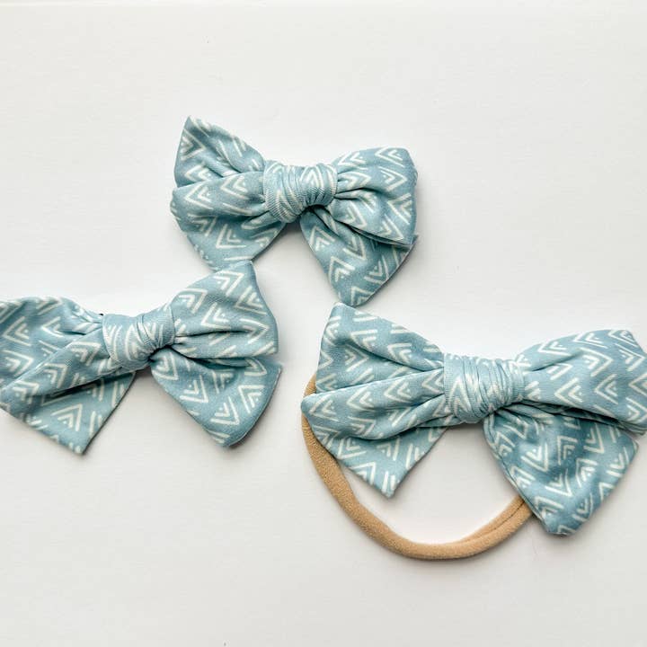 Arc à flèches bleues pour la vente par Jensens Jammies