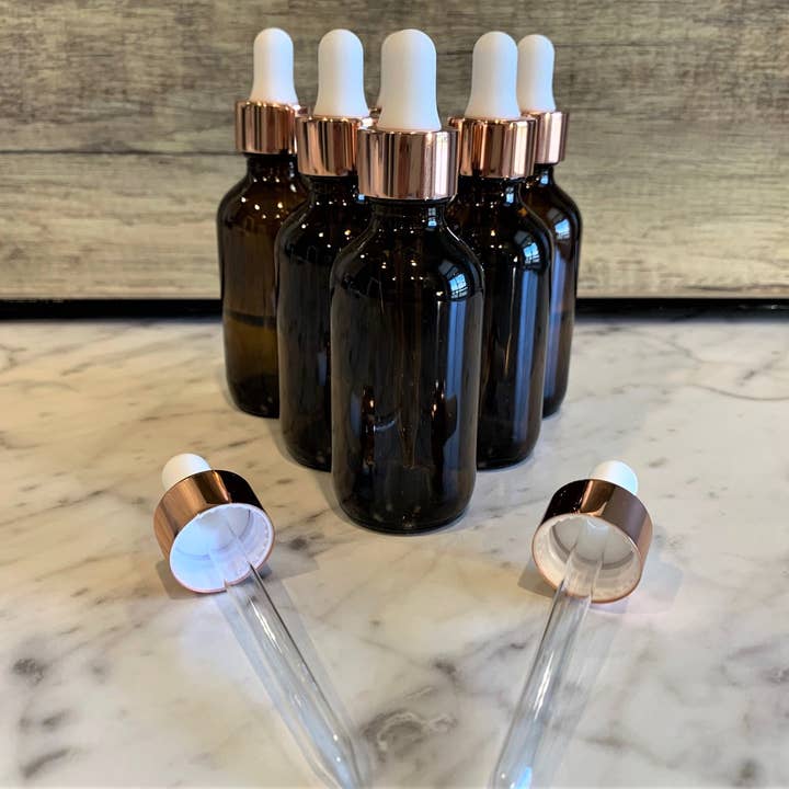 The Bottle Shoppe - Wholesale Essential oil holder - 2oz Amber Glass Bottle with White & Rose Gold Glass Dropper0