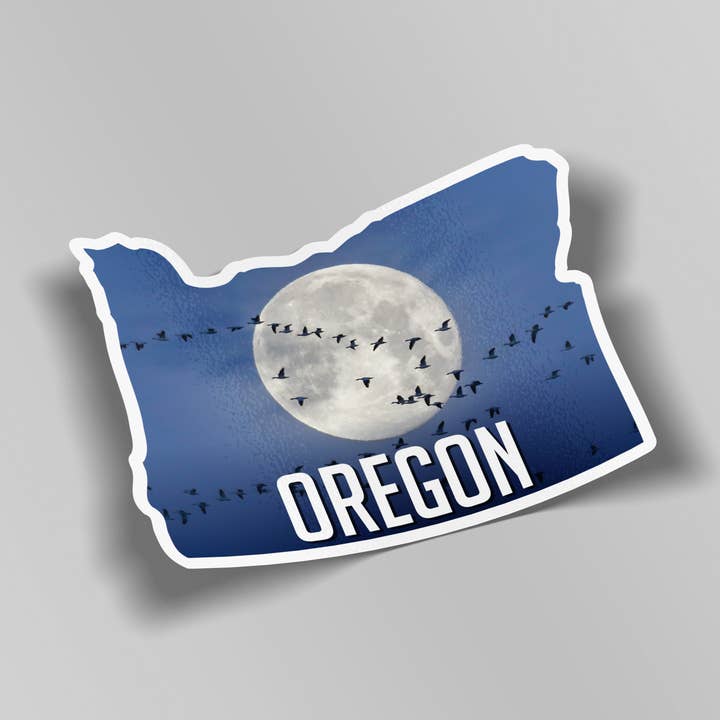 Oregon Sticker - Snow geese passing the moon. for wholesale by Elster Photography/Big Picture Greetings
