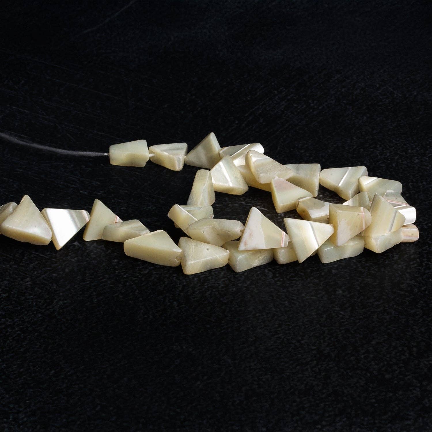 The Bead Traders - Wholesale Beads - 8-10mm Mother of Pearl Plain Triangles 12 inch 40 beads1