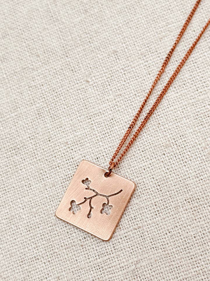 Brushed Rose Gold Flower Cutout Square Charm Necklace for wholesale by Gracie Rose Designs