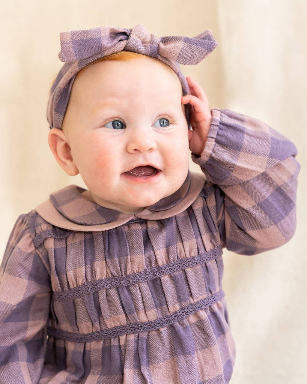 Lilac Smocked Peter Pan Gingham Baby Romper (Organic) for wholesale on Faire6