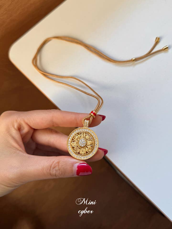 Good Fortune Rotating Compass Pendant for wholesale by MINICYBER STUDIO