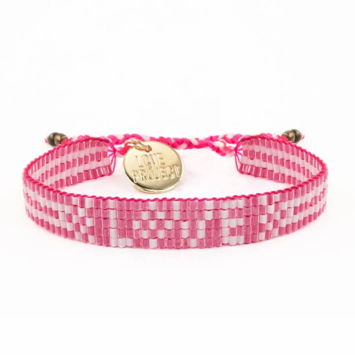 Pretty in Pink Bali Seed LOVE Bracelet for wholesale by Love Is Project