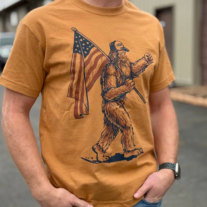 Bigfoot USA Flag Tee - Toast (100% Cotton) for wholesale by IdaWholesale