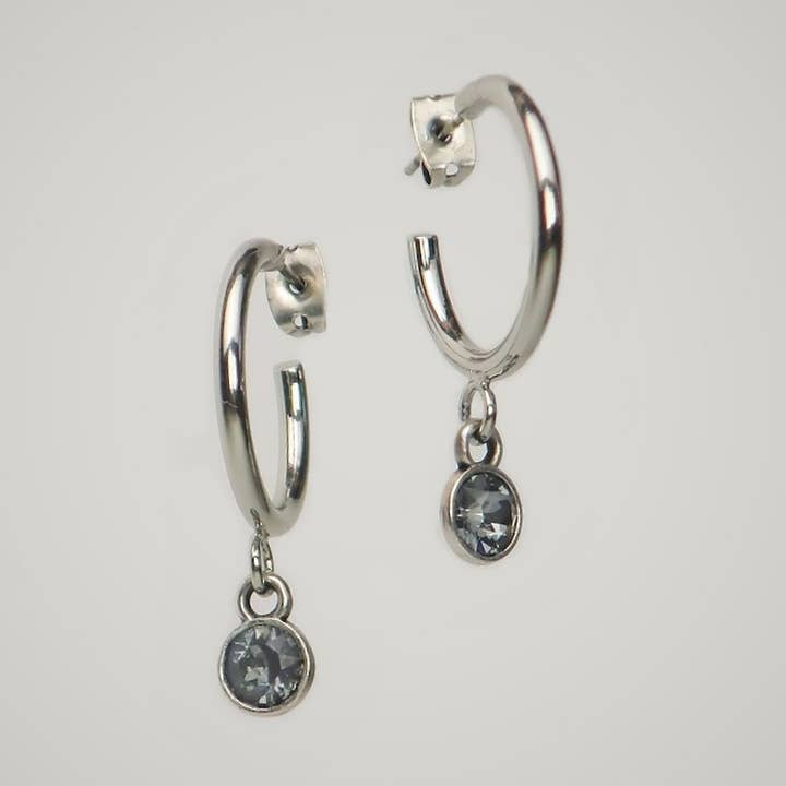 Lollia Modeschmuck - Wholesale Huggie Earrings - Open hoop earrings with a “silver shade” crystal0