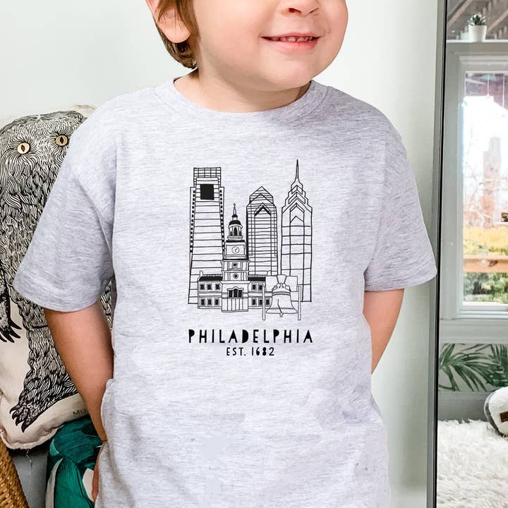 Grigio erica Philadelphia, PA Skyline - Maglietta per bambini - PHL, Philly in vendita all'ingrosso su Faire1