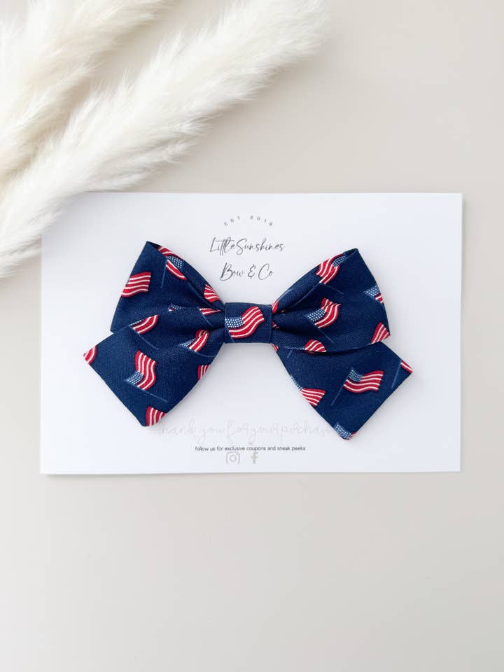 Navy American Flags 4th of July Pinwheel Hair Bow for wholesale by Little Sunshines Bow & Co