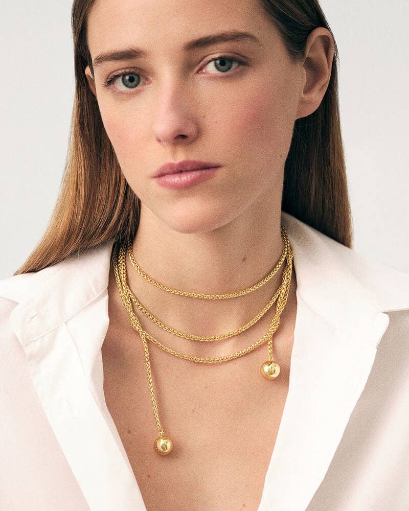 HoopLa - Vendita all'ingrosso Collane a catena e maglie - Collana in acciaio con corda a laccio, nappina a sfera e catena avvolgente Audrey.3