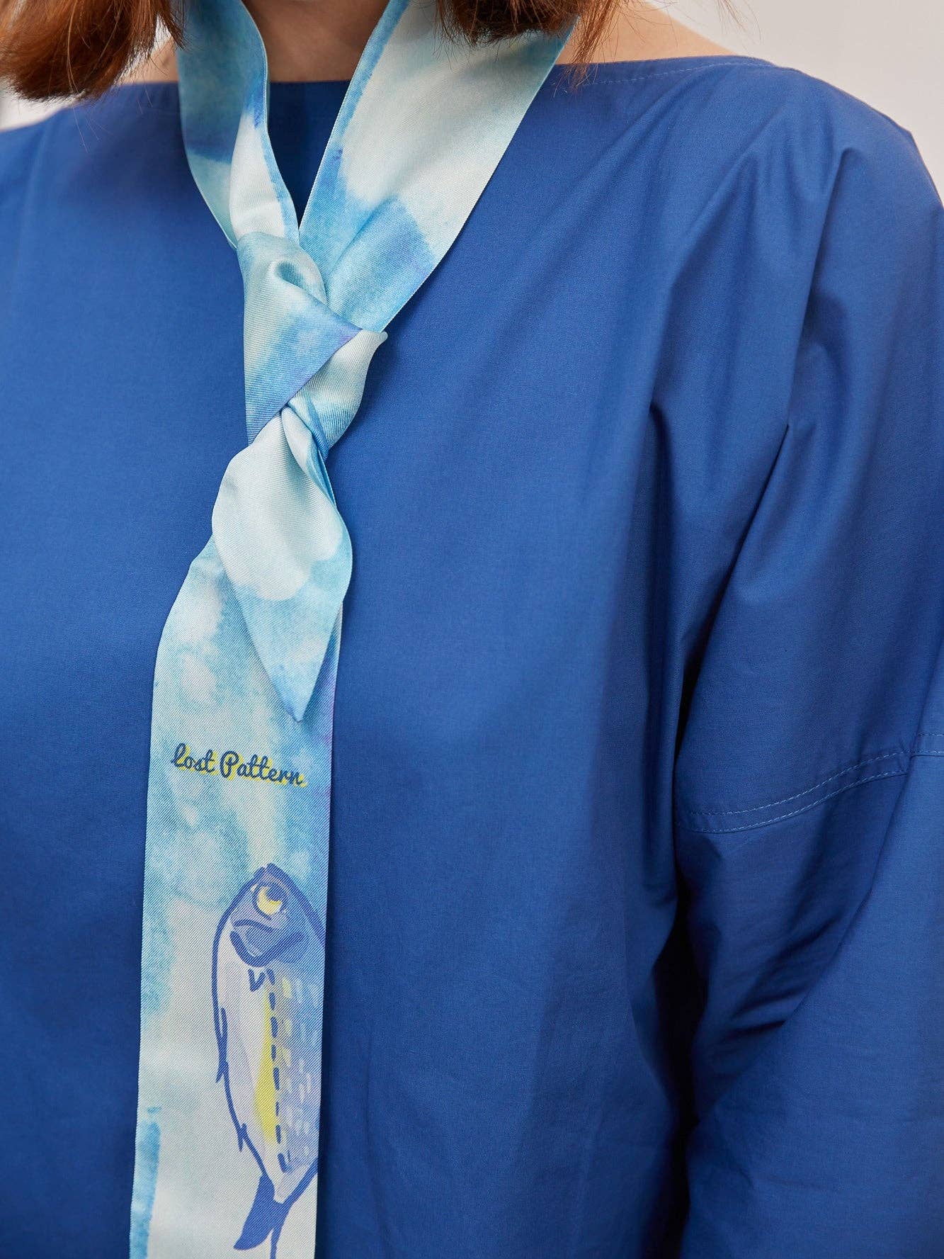 Blue "Blue Fin" Silk Skinny Scarf for wholesale on Faire4