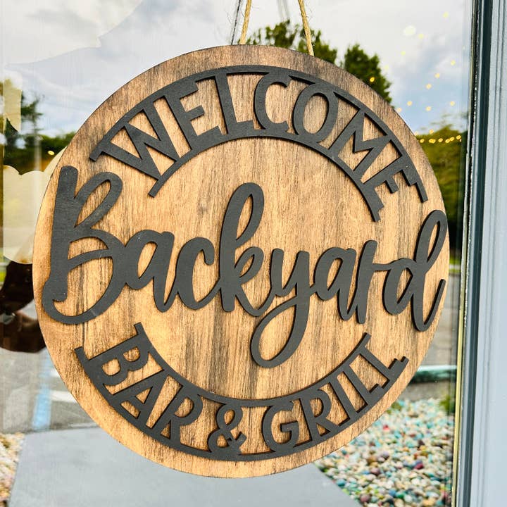 Welcome Backyard Bar & Grill Door Hanger P02732 for wholesale by Paisley Grace Makery