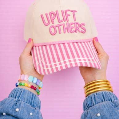 "Uplift Others" on Tan Cap with Patch Work for wholesale on Faire0