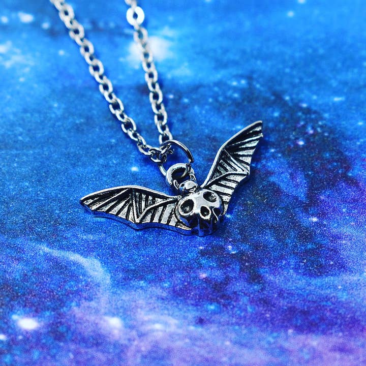 Bat pendant with minimalist skull for wholesale by JorieJewelry