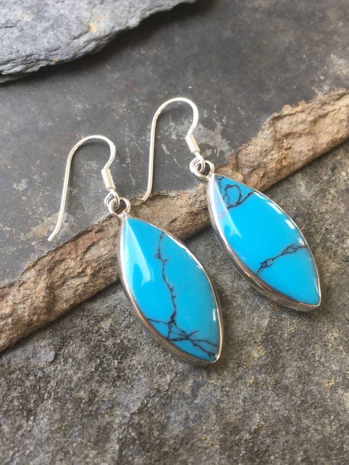 SE353B - BLUE/MOP SHIELD 28MM X 13MM EARRING for wholesale by Bluelily925silver