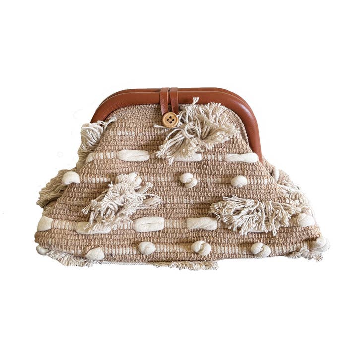 Shores Clutch and other Purchase Wholesale pom pom trim. Free Returns & Net 60 Terms on Faire trending on Faire.